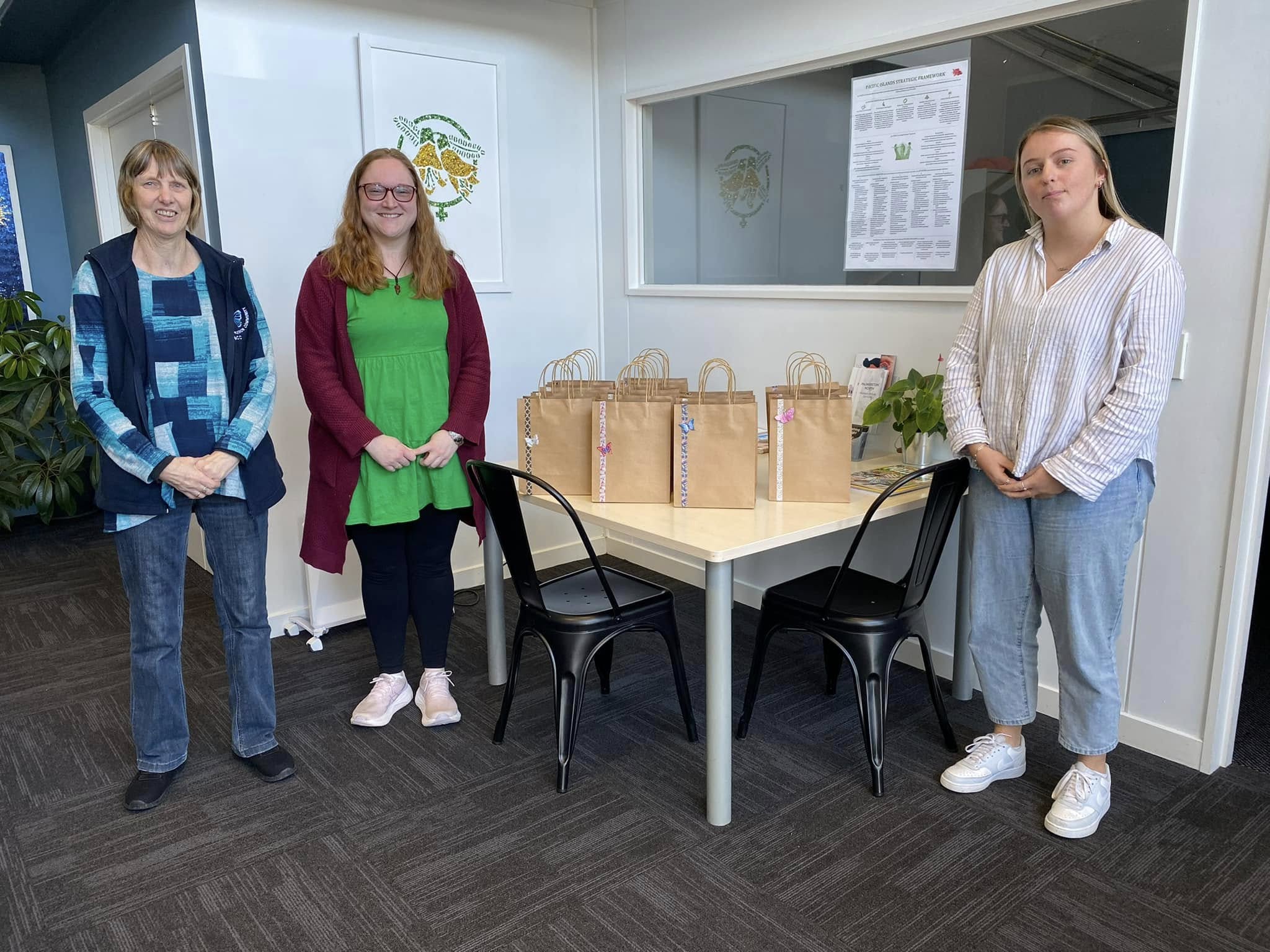 Volunteer helping distribute care items at Butterfly Compassion Community donation centre.